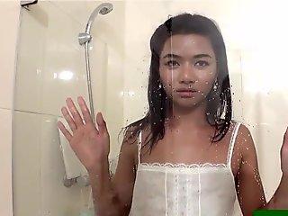 TS ladyboy Poopae takes steamy shower